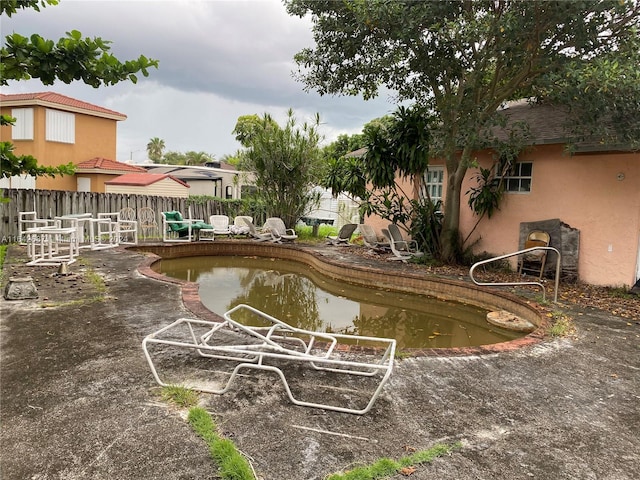 view of home's community featuring a patio area