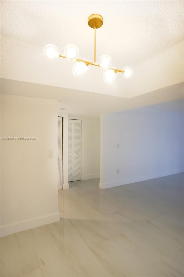 spare room with a textured ceiling