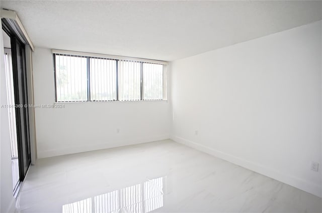 empty room with a textured ceiling