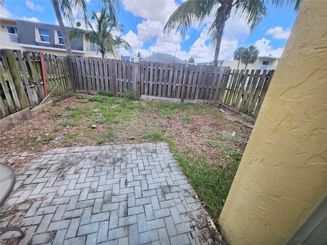 view of yard featuring a mountain view and a patio