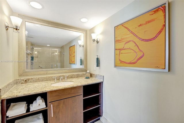 full bathroom with recessed lighting, a shower stall, and vanity