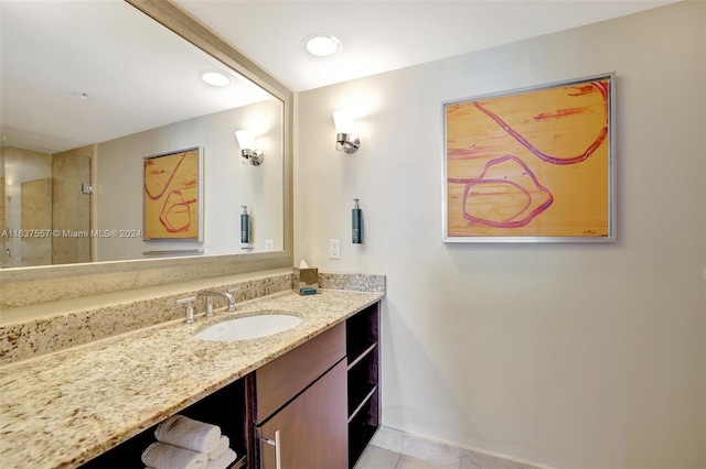 bathroom with recessed lighting, baseboards, and vanity