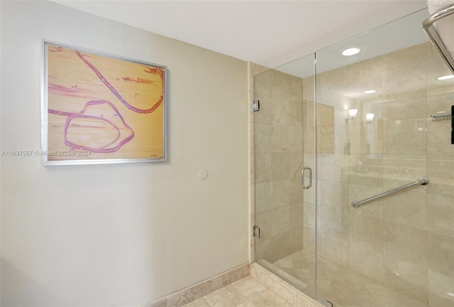 bathroom with recessed lighting, a shower stall, baseboards, and tile patterned floors