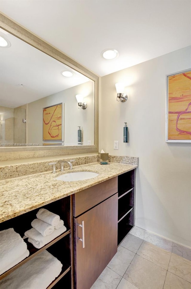 bathroom with baseboards and vanity