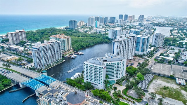 aerial view featuring a view of city and a water view