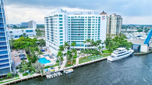 view of building exterior with a view of city and a water view