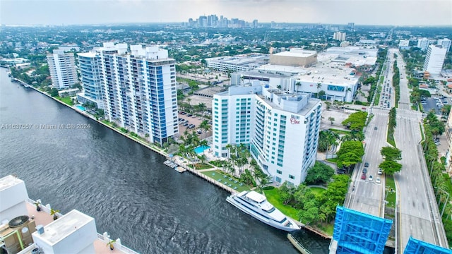 bird's eye view featuring a water view and a city view