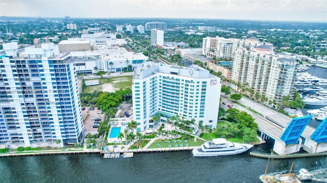 birds eye view of property with a view of city and a water view