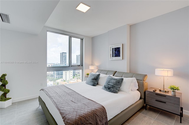 bedroom featuring light tile patterned floors