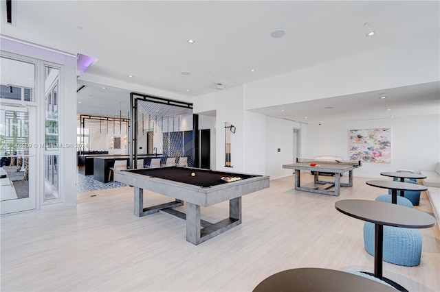 recreation room with light hardwood / wood-style floors and pool table