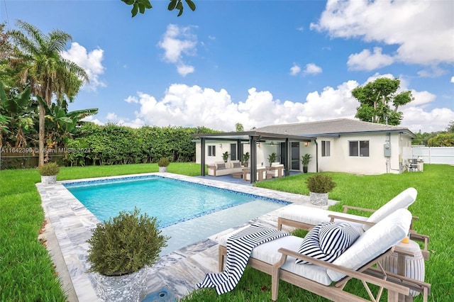 view of pool with a lawn and a patio