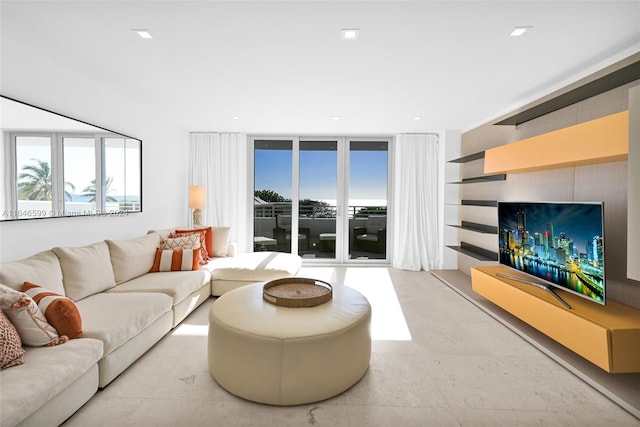 living room featuring floor to ceiling windows