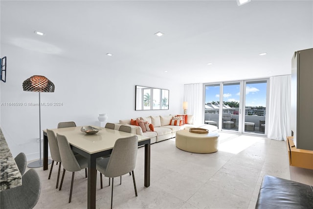 dining area featuring floor to ceiling windows