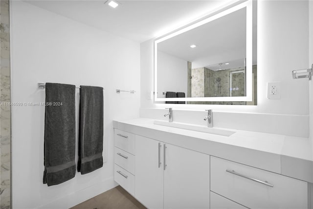 bathroom featuring vanity and walk in shower