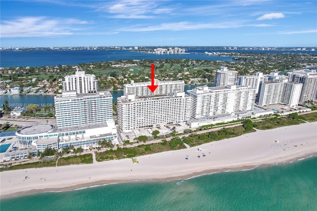 aerial view featuring a view of the beach and a water view