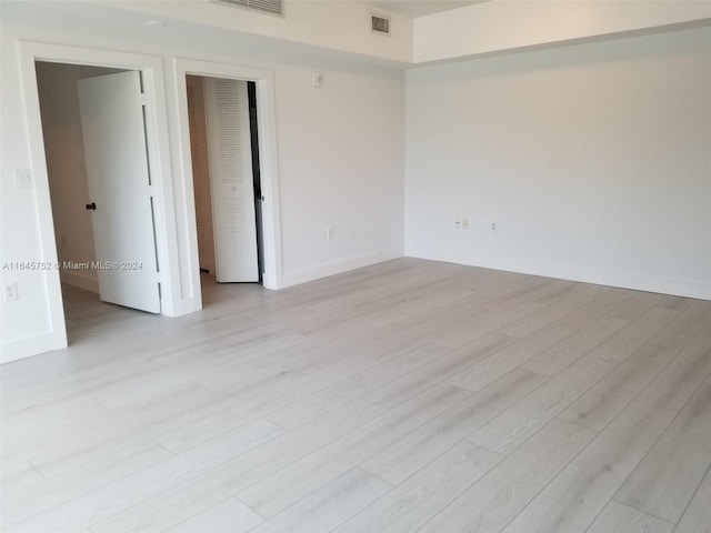 empty room featuring light hardwood / wood-style floors