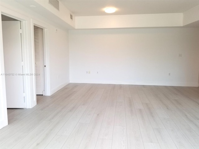 unfurnished room featuring light hardwood / wood-style flooring