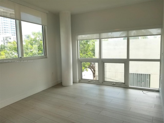 unfurnished room featuring light hardwood / wood-style floors