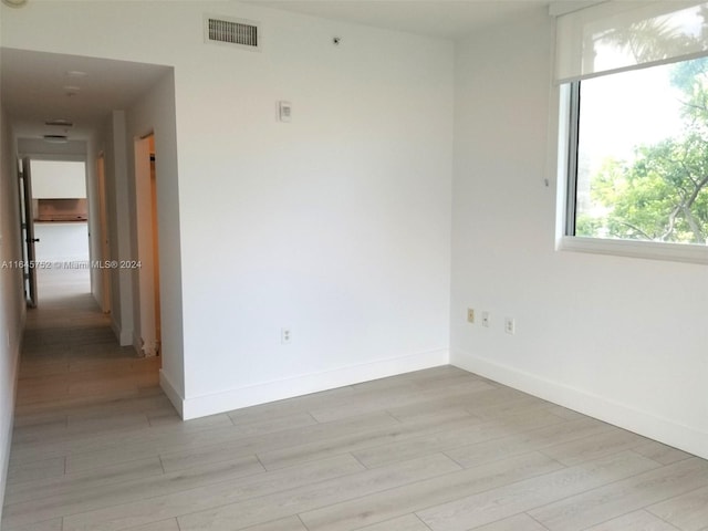 unfurnished room featuring light wood-type flooring