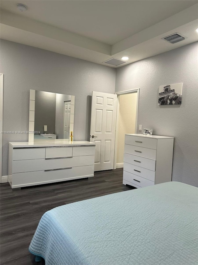 bedroom featuring dark wood-type flooring