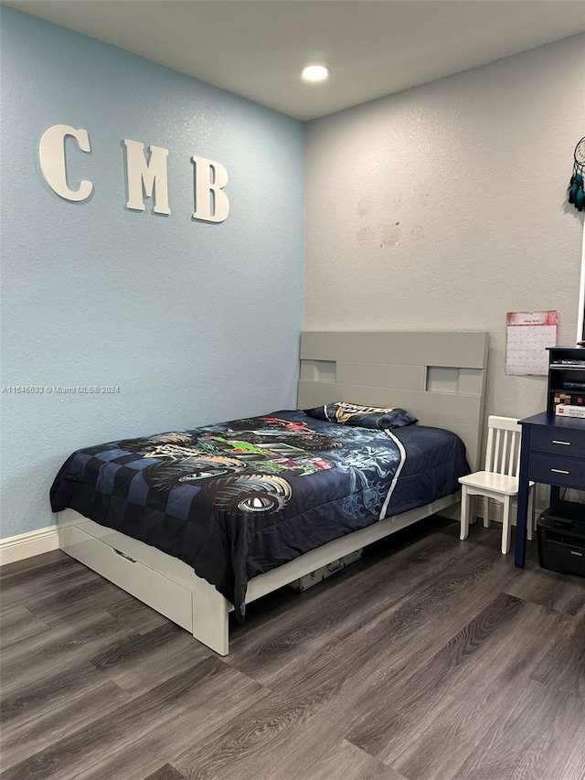 bedroom featuring dark wood-type flooring