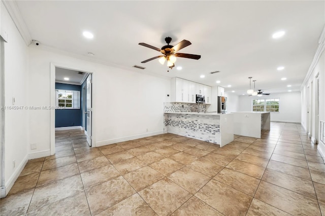 kitchen featuring light tile patterned flooring, ceiling fan, crown molding, kitchen peninsula, and white cabinets