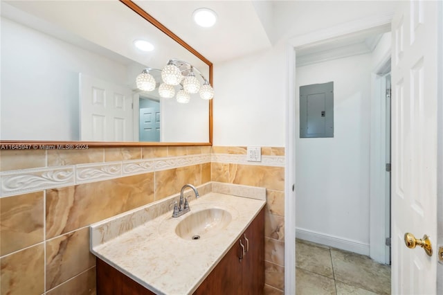 bathroom featuring tile walls, tile patterned floors, vanity, and electric panel