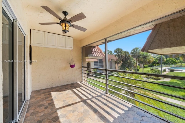 balcony featuring ceiling fan