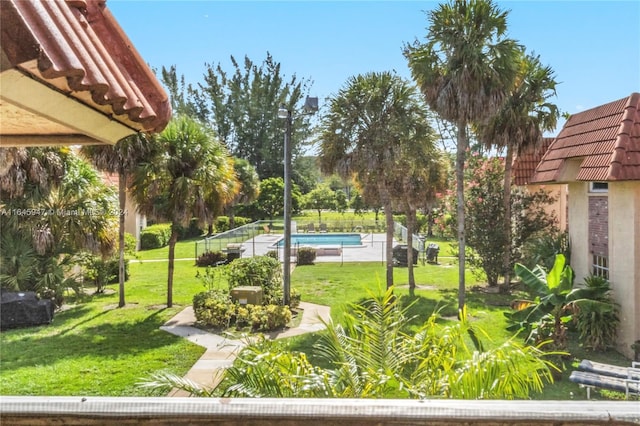 view of yard with a fenced in pool