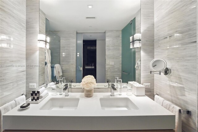 bathroom with tile walls and vanity