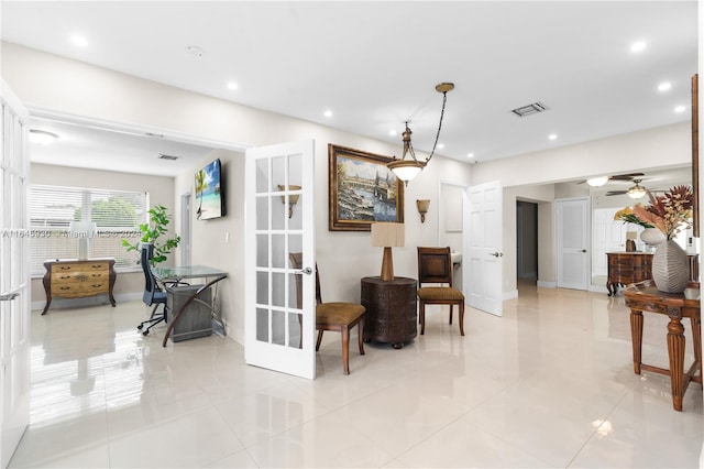 interior space with ceiling fan, light tile patterned floors, and french doors