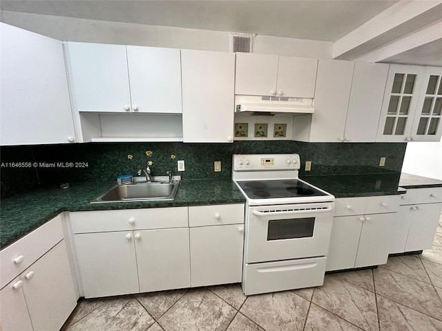 kitchen featuring decorative backsplash, electric range, white cabinetry, light tile patterned floors, and sink