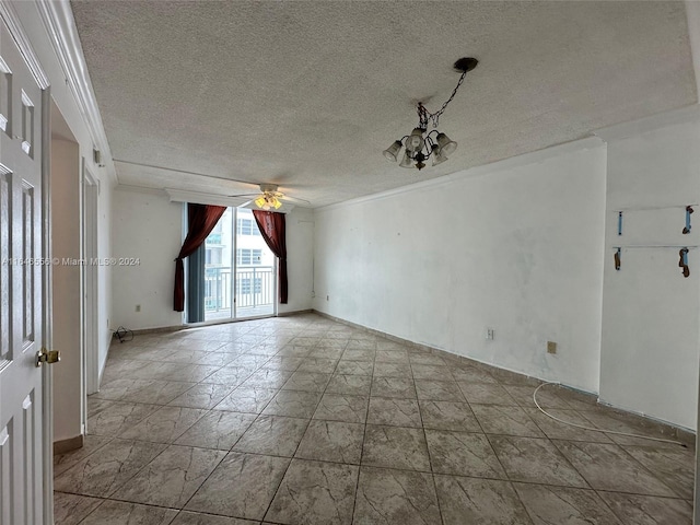 tiled spare room with a textured ceiling, ceiling fan with notable chandelier, and ornamental molding