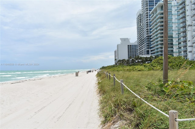 view of water feature with a beach view