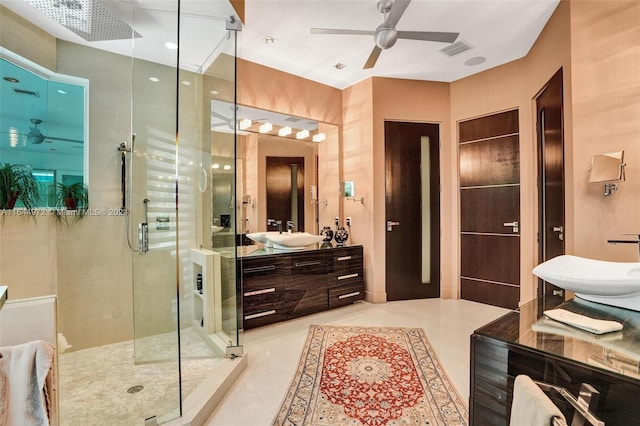 bathroom featuring tile patterned flooring, ceiling fan, a shower with door, and vanity