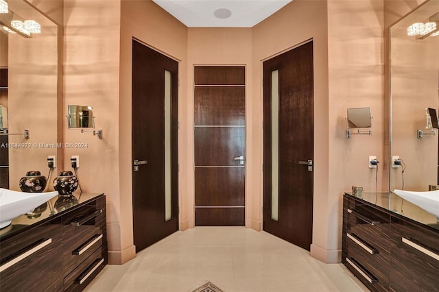 bathroom featuring tile patterned flooring and vanity