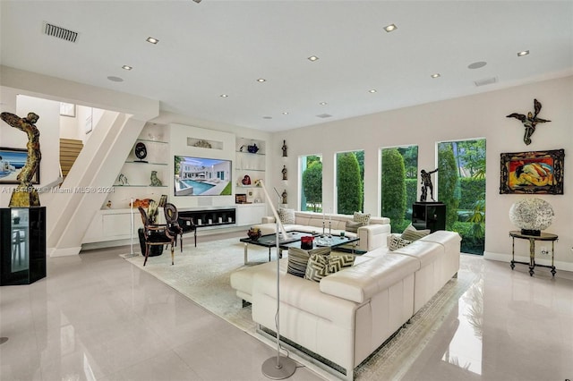 tiled living room featuring built in features