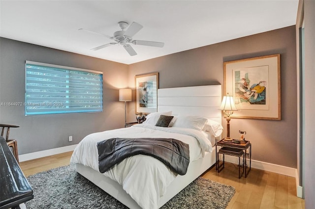 bedroom featuring light hardwood / wood-style floors and ceiling fan