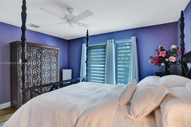 bedroom with hardwood / wood-style flooring and ceiling fan