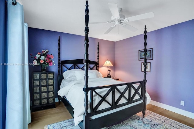 bedroom featuring ceiling fan and wood-type flooring