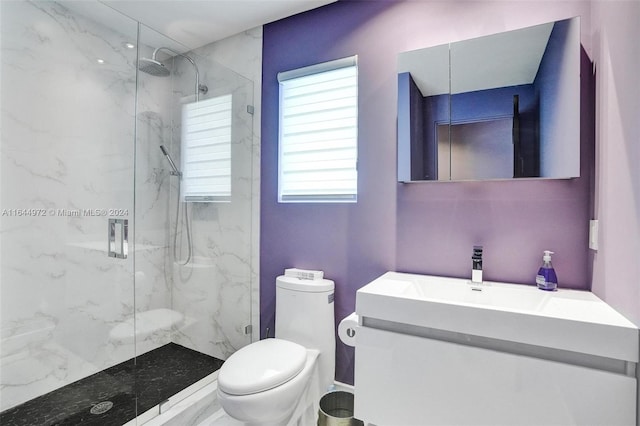 bathroom with vanity, toilet, and an enclosed shower