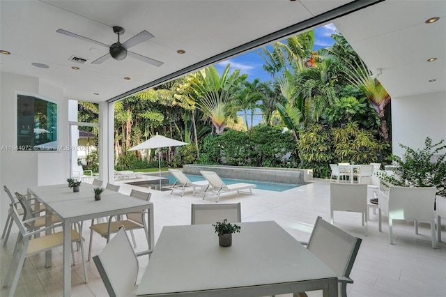 view of patio featuring ceiling fan