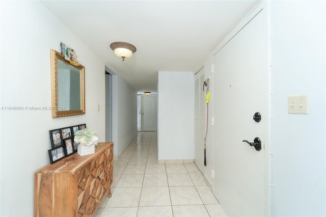 corridor featuring light tile patterned flooring