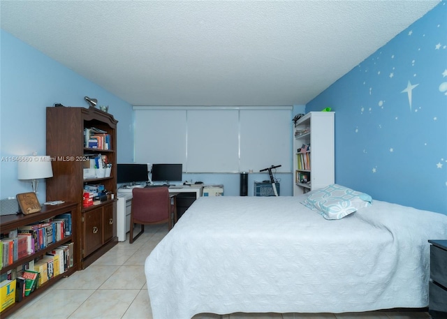 tiled bedroom with a textured ceiling