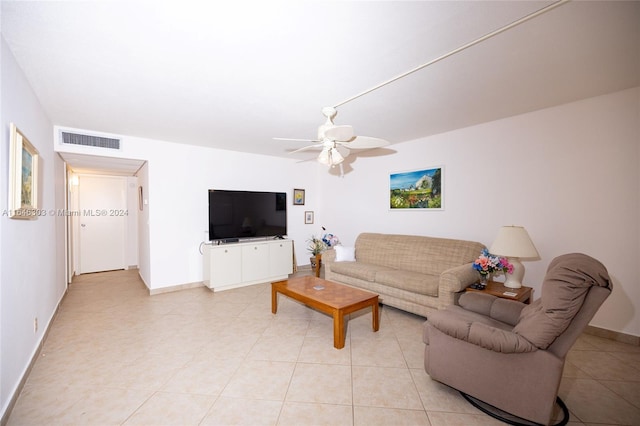 tiled living room featuring ceiling fan