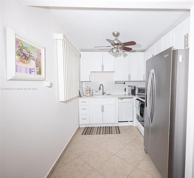 kitchen featuring backsplash, stainless steel appliances, white cabinetry, ceiling fan, and light tile patterned flooring