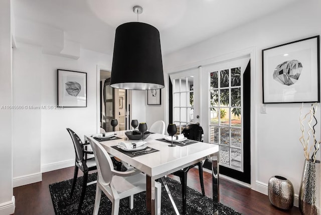 dining space featuring french doors and dark hardwood / wood-style floors