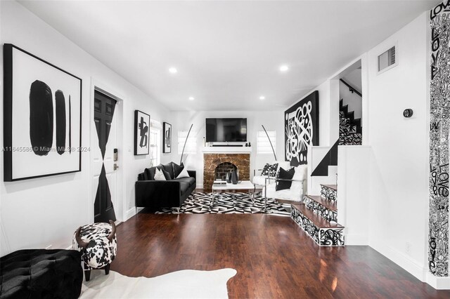 interior space featuring a fireplace and wood-type flooring