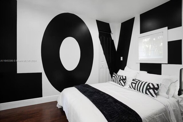 bedroom featuring wood-type flooring