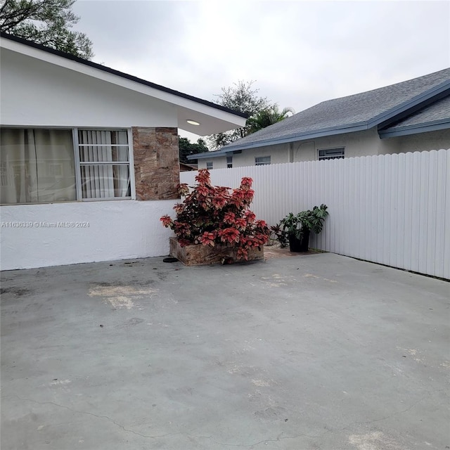 view of patio featuring fence